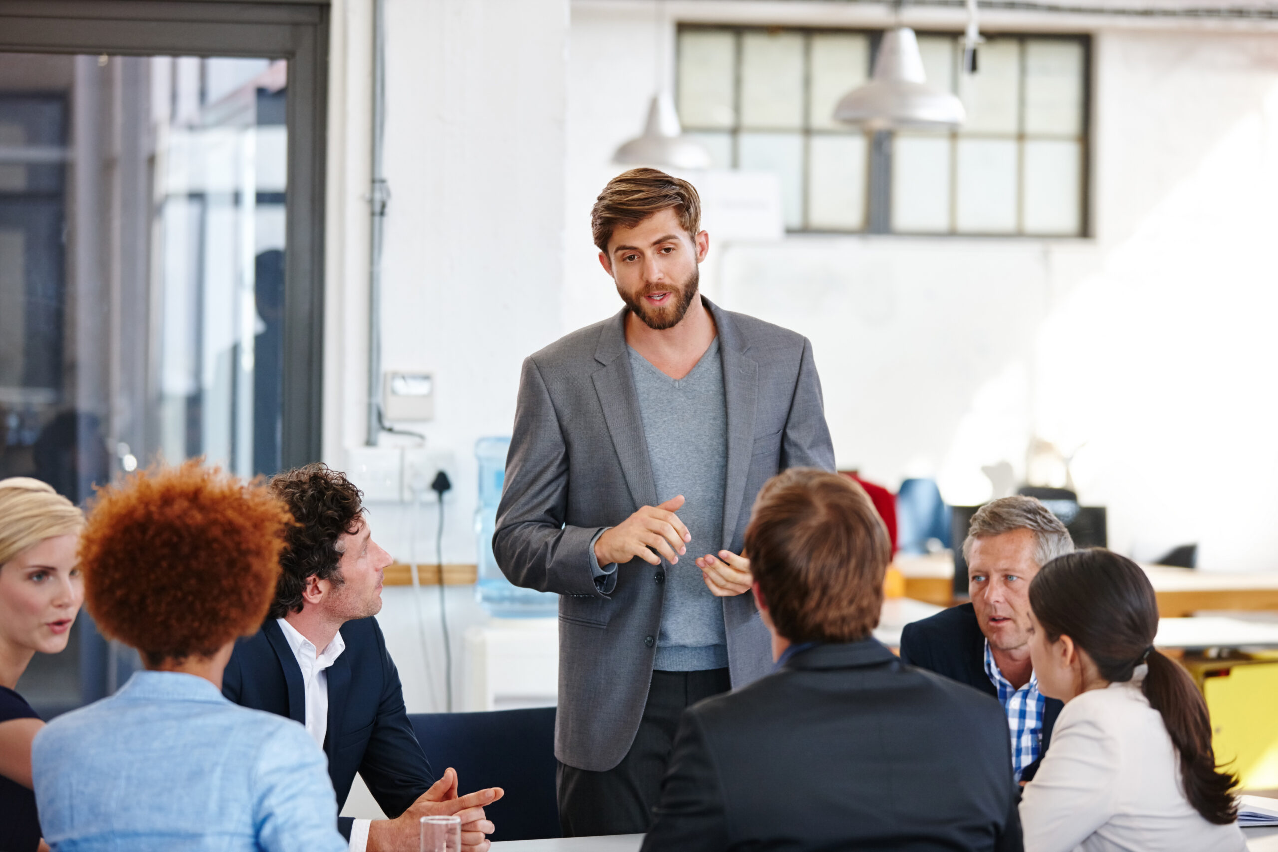 A professional with people skills helping others attain team success